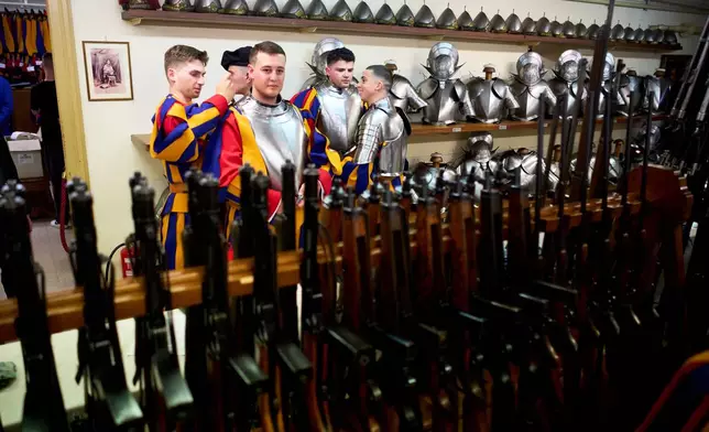Pontifical Swiss Guards prepare ahead of their swearing in ceremony, at the Vatican, Wednesday, May 6, 2026. (AP Photo/Andrew Medichini)
