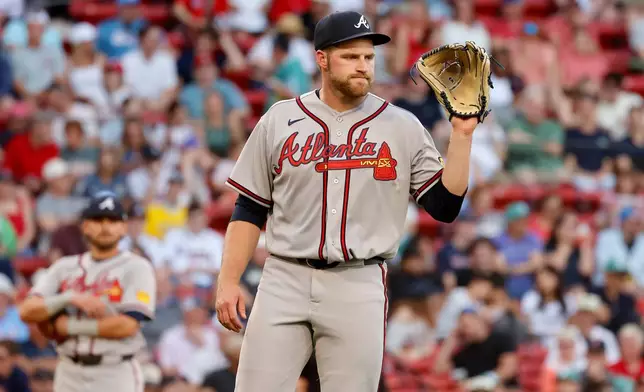 Atlanta Braves starting pitcher Bryce Elder (55) reacts after committing a throwing error during the second inning of a baseball game against the Boston Red Sox at Fenway Park, Wednesday, May 27, 2026, in Boston. (AP Photo/Mary Schwalm)