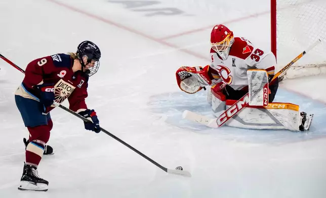Montreal Victoire's Kati Tabin (9) scores on Ottawa Charge goaltender Gwyneth Philips (33) during the second period in Game 2 of the PWHL Walter Cup finals hockey series in Laval, Quebec, Saturday, May 16, 2026.(Christopher Katsarov/The Canadian Press via AP)