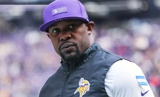 FILE - Minnesota Vikings defensive coordinator Brian Flores stands on the sideline during the first half of an NFL football game against the Chicago Bears, Sunday, Nov. 16, 2025, in Minneapolis. (AP Photo/Matt Krohn, File)