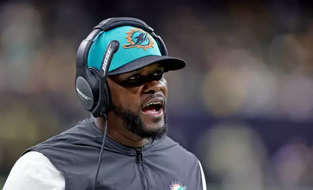 FILE - Miami Dolphins coach Brian Flores yells during the second half of an NFL football game against the New Orleans Saints Monday, Dec. 27, 2021, in New Orleans. (AP Photo/Butch Dill, File)