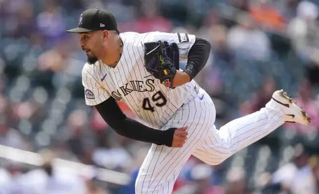 Colorado Rockies relief pitcher Antonio Senzatela works against the Texas Rangers in the seventh inning of a baseball game Wednesday, May 20, 2026, in Denver. (AP Photo/David Zalubowski)