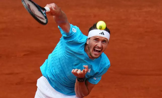 Alexander Zverev, of Germany, serves the ball to Jannik Sinner, of Italy, during their men's singles tennis final match at the Madrid Open tennis tournament in Madrid, Spain, Sunday, May 3, 2026. (AP Photo/Manu Fernandez)