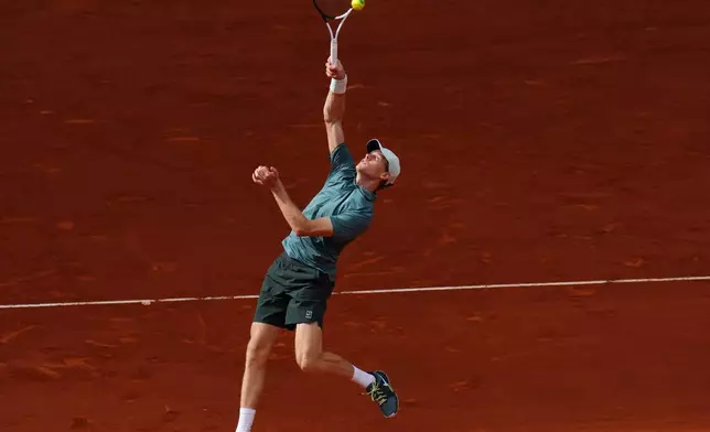 Jannik Sinner, of Italy, returns the ball to Alexander Zverev, of Germany, during their men's singles tennis final match at the Madrid Open tennis tournament in Madrid, Spain, Sunday, May 3, 2026. (AP Photo/Manu Fernandez)