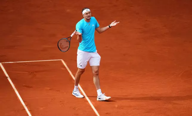 Alexander Zverev, of Germany, gestures during the men's singles tennis final match against Jannik Sinner, of Italy, at the Madrid Open tennis tournament in Madrid, Spain, Sunday, May 3, 2026. (AP Photo/Manu Fernandez)