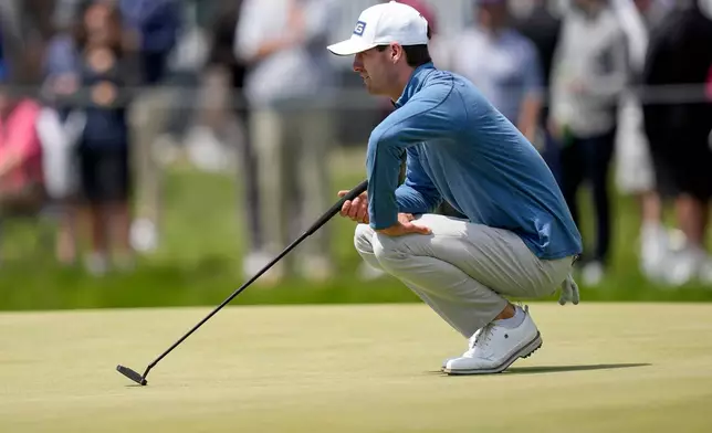 Alex Smalley lines up his putt on the 17th green during the second round of the PGA Championship golf tournament at Aronimink Golf Club, Friday, May 15, 2026, in Newtown Square, PA. (AP Photo/Matt Slocum)