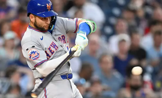 New York Mets' Bo Bichette hits a two run home run during the second inning of a baseball game Washington Nationals, Tuesday, May 19, 2026, in Washington. (AP Photo/John McDonnell)