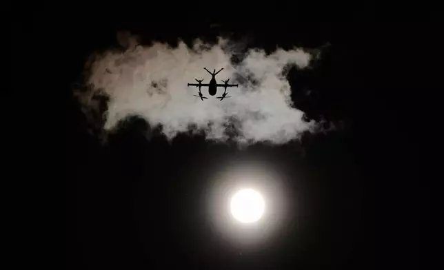 A drone operated by Zipline flies to make a delivery from a Walmart store in Pea Ridge, Ark., Friday, Sept. 26, 2025. (AP Photo/Charlie Riedel)