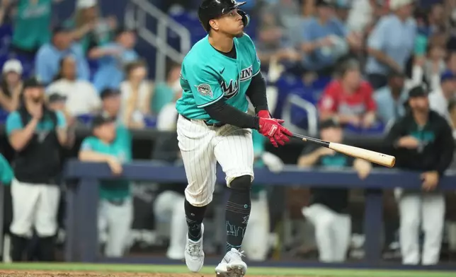 Miami Marlins' Heriberto Hernández watches after hitting a walk-off grand slam in the ninth inning to defeat the New York Mets in a baseball game, Sunday, May 24, 2026, in Miami. (AP Photo/Lynne Sladky)