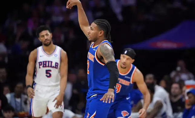 New York Knicks' Miles McBride reacts after scoring during the second half of Game 4 against the Philadelphia 76ers in a second-round NBA basketball playoffs series Sunday, May 10, 2026, in Philadelphia. (AP Photo/Matt Slocum)