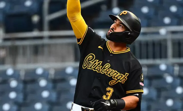 Pittsburgh Pirates' Nick Gonzales gestures at first base after hitting an RBI single during the first inning of a baseball game against the Colorado Rockies in Pittsburgh, Tuesday, May 12, 2026. (AP Photo/Justin Berl)