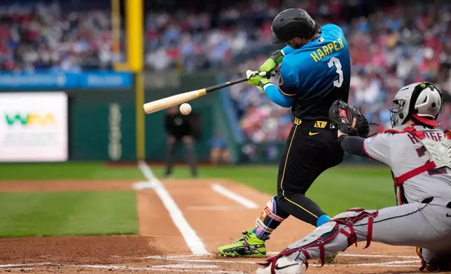 Philadelphia Phillies' Bryce Harper hits a double against Cleveland Guardians pitcher Gavin Williams during the first inning of a baseball game Friday, May 22, 2026, in Philadelphia. (AP Photo/Matt Slocum)