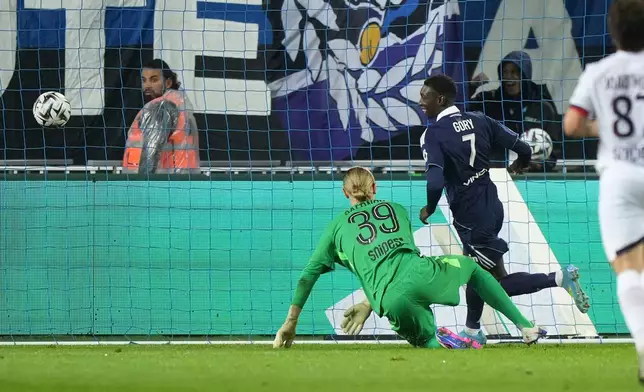 Paris FC's Alimami Gory, second from right, celebrates after scoring his side's second goal past PSG's goalkeeper Matvey Safonov during the French League One soccer match between Paris FC and Paris Saint-Germain in Paris, Sunday, May 17, 2026. (AP Photo/Michel Euler)