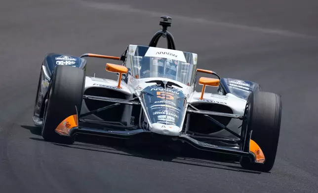 Pato O'Ward, of Mexico, drives through the third turn during qualifications for the Indianapolis 500 auto race at the Indianapolis Motor Speedway in Indianapolis, Sunday, May 17, 2026. (AP Photo/Michael Conroy)