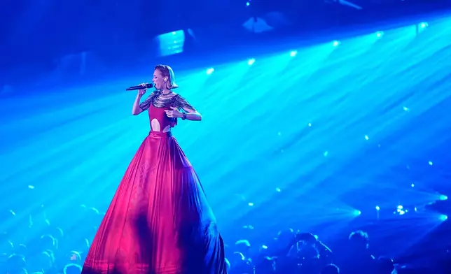 Aliona Moon sings "Viva Moldova" during her featured performance with Satoshi from Moldova during the dress rehearsal for the Grand Final of the 70th Eurovision Song Contest in Vienna, Austria, Friday, May 15, 2026. CORRECTS PERFORMERS NAME TO ALIONA MOON FROM SATOSHI. (AP Photo/Martin Meissner)