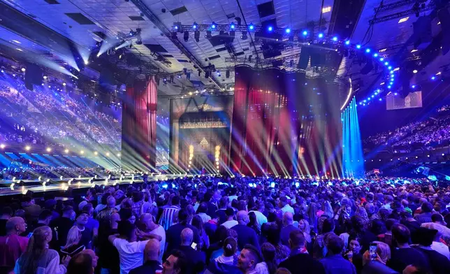 Spectators wait for the start of the Grand Final of the 70th Eurovision Song Contest in Vienna, Austria, Saturday, May 16, 2026. (AP Photo/Martin Meissner)