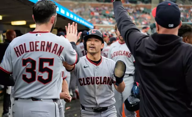 Cleveland Guardians' Steven Kwan celebrates scoring against the Detroit Tigers during the seventh inning of a baseball game Tuesday, May 19, 2026, in Detroit. (AP Photo/Paul Sancya)