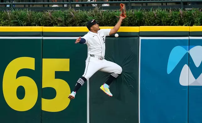 Detroit Tigers right fielder Wenceel Pérez can't catch a Cleveland Guardians' Steven Kwan fly ball during the seventh inning of a baseball game Tuesday, May 19, 2026, in Detroit. (AP Photo/Paul Sancya)