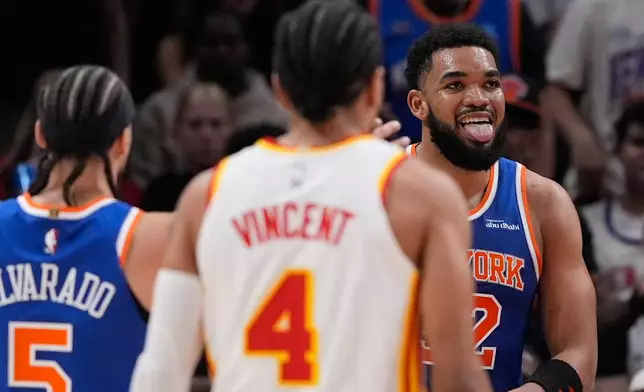New York Knicks center Karl-Anthony Towns (32) celebrates scoring in the first half during Game 6 in a first-round NBA basketball playoffs series against the Atlanta Hawks Thursday, April 30, 2026, in Atlanta. (AP Photo/Brynn Anderson)