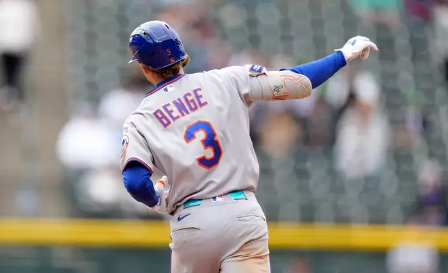 New York Mets' Carson Benge gestures to the bullpen as he circles the bases after hitting a solo home run off Colorado Rockies starting pitcher Tomoyuki Sugano in the sixth inning of a baseball game Monday, May 4, 2026, in Denver. (AP Photo/David Zalubowski)