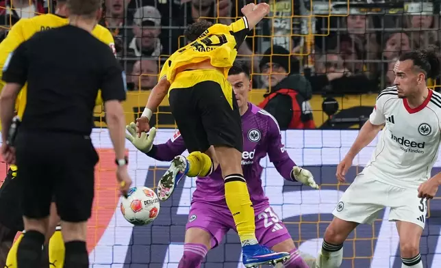 Dortmund's Samuele Inacio scores during the German Bundesliga soccer match between Borussia Dortmund and Eintracht Frankfurt in Dortmund, Germany, Friday, May 8, 2026. (AP Photo/Martin Meissner)