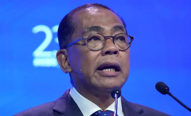 Malaysia's Defense Minister Dato' Seri Mohamed Khaled Nordin delivers a speech during the Shangri-La Dialogue, Asia's annual defense and security forum, in Singapore, Sunday, May 31, 2026. (AP Photo/Achmad Ibrahim)