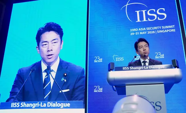Japan's Defense Minister Shinjiro Koizumi delivers a speech during the Shangri-La Dialogue, Asia's annual defense and security forum, in Singapore, Sunday, May 31, 2026. (AP Photo/Achmad Ibrahim)