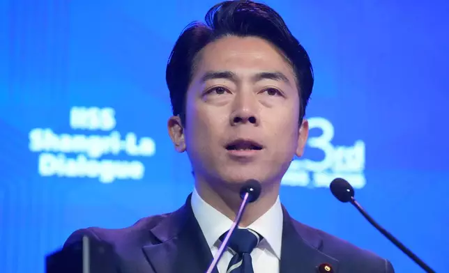 Japan's Defense Minister Shinjiro Koizumi delivers a speech during the Shangri-La Dialogue, Asia's annual defense and security forum, in Singapore, Sunday, May 31, 2026. (AP Photo/Achmad Ibrahim)