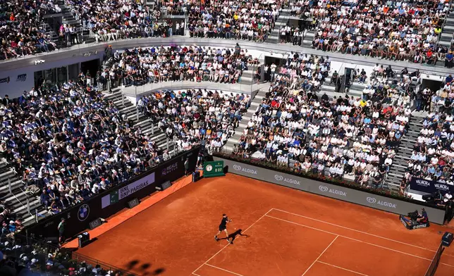 Italy's Jannik Sinner strikes a forehand to Australia's Alexei Popyrin, during their match at the Italian Open tennis tournament in Rome, Monday, May 11, 2026. (AP Photo/Alessandra Tarantino)