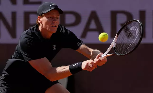 Italy's Jannik Sinner returns a ball to Daniil Medvedev of Russia during their semifinal match at the Italian Open tennis tournament in Rome, Saturday, May 16, 2026. (AP Photo/Alessandra Tarantino)