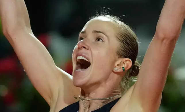 Ukraine's Elina Svitolina celebrates after winning against United States' Coco Gauff at the end of the women's final match at the Italian Open tennis tournament in Rome, Saturday, May 16, 2026. (AP Photo/Alessandra Tarantino)