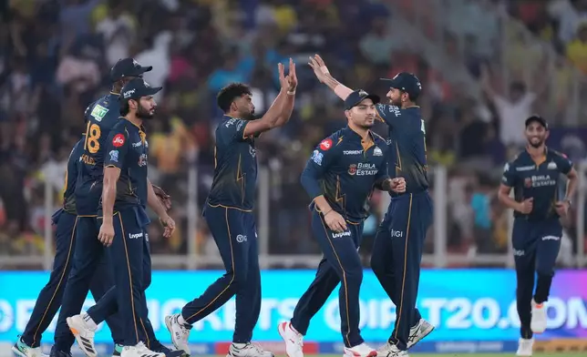 Gujarat Titans' Mohammed Siraj celebrate with teammates the wicket of Chennai Super Kings' Sanju Samson during the Indian Premier League cricket match between Gujarat Titans and Chennai Super Kings in Ahmedabad, India, Thursday, May 21, 2026.(AP Photo/Ajit Solanki)
