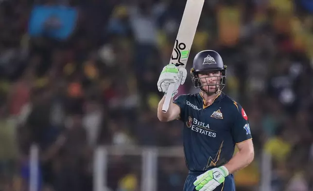 Gujarat Titans' Jos Buttler celebrates his fifty runs during the Indian Premier League cricket match between Gujarat Titans and Chennai Super Kings in Ahmedabad, India, Thursday, May 21, 2026.(AP Photo/Ajit Solanki)