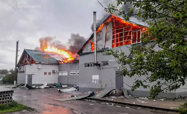 In this photo provided by the Ukrainian Emergency Service, a prayer house of a local Protestant community of Evangelical Christian Baptists burns following a Russian air attack in Balakliia, Kharkiv region, Ukraine, Saturday, May 23, 2026. (Ukrainian Emergency Service via AP)