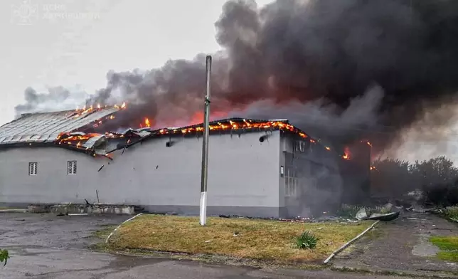 In this photo provided by the Ukrainian Emergency Service, a prayer house of a local Protestant community of Evangelical Christian Baptists burns following a Russian air attack in Balakliia, Kharkiv region, Ukraine, Saturday, May 23, 2026. (Ukrainian Emergency Service via AP)