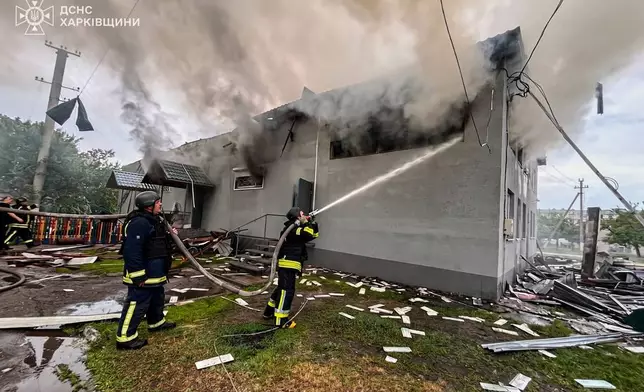 In this photo provided by the Ukrainian Emergency Service, firefighters put out the fire at a prayer house of a local Protestant community of Evangelical Christian Baptists following Russian air attack in Balakliia, Kharkiv region, Ukraine, Saturday, May 23, 2026. (Ukrainian Emergency Service via AP)
