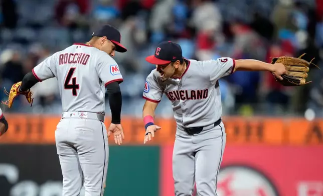 Cleveland Guardians' Brayan Rocchio, left, and Steven Kwan celebrate after the Guardians won a baseball game against the Philadelphia Phillies Friday, May 22, 2026, in Philadelphia. (AP Photo/Matt Slocum)