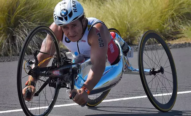 FILE - In this Saturday, Oct. 10, 2015 file photo, Alex Zanardi, of Italy, rides during the cycling portion of the Ironman World Championship Triathlon, in Kailua-Kona, Hawaii. (AP Photo/Mark J. Terrill, File)
