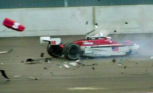 FILE - Italian driver Alex Zanardi's car breaks up after it crashed with Canadian driver Alex Tagliani during the CART car race at the Eurospeedway Lausitz in Klettwitz, eastern Germany, Saturday, Sept. 15, 2001. (AP Photo/Eckehard Schulz)