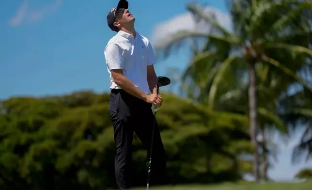 Jordan Spieth reacts to his shot from the eighth tee during the third round of the Cadillac Championship PGA golf tournament Saturday, May 2, 2026, in Doral, Fla. (AP Photo/David J. Phillip)