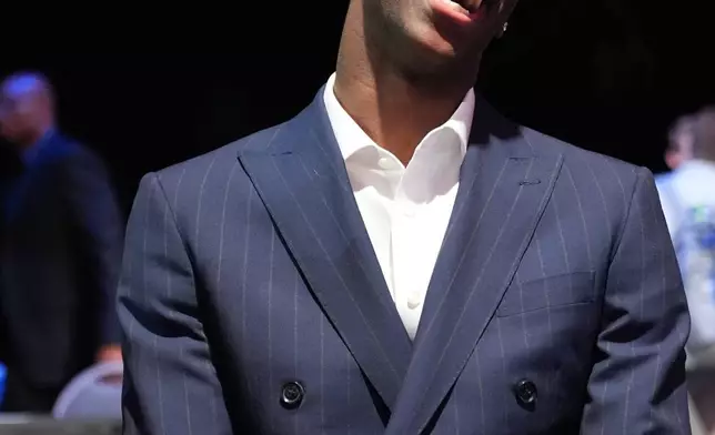 BYU forward AJ Dybantsa smiles as he talks to media during the NBA basketball draft lottery in Chicago, Sunday, May 10, 2026. (AP Photo/Nam Y. Huh)