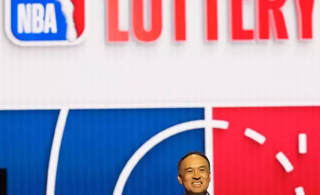 NBA Deputy Commissioner Mark Tatum announces that the Washington Wizards won the first pick in the NBA basketball draft lottery in Chicago, Sunday, May 10, 2026. (AP Photo/Nam Y. Huh)