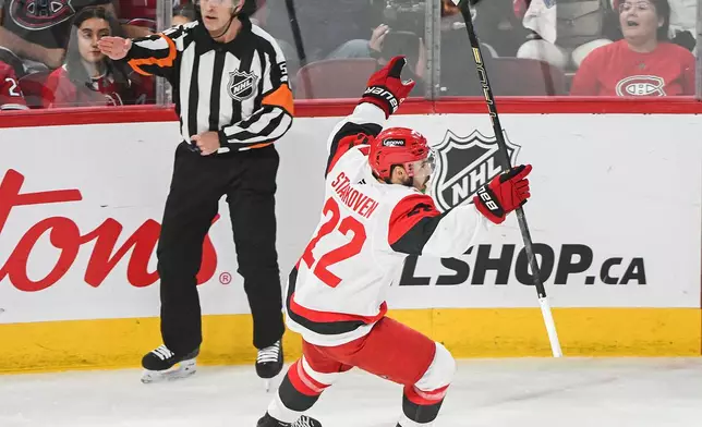 Carolina Hurricanes' Logan Stankoven (22) reacts after scoring against the Montreal Canadiens during the first period of Game 4 of NHL Eastern Conference final Stanley Cup playoff series action in Montreal, Quebec, Wednesday, May 27, 2026. (Graham Hughes/The Canadian Press via AP)