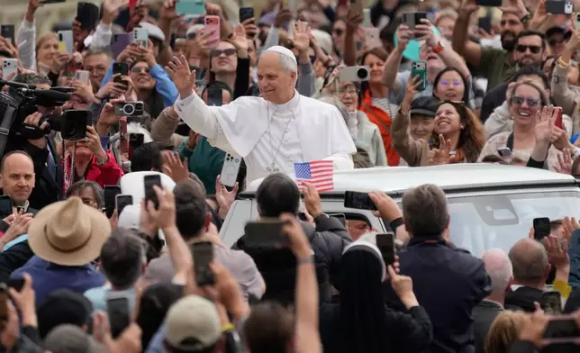 Pope Leo XIV arrives as he holds his weekly general audience in St. Peter's Square, at the Vatican, Wednesday, May 6, 2026. (AP Photo/Gregorio Borgia)