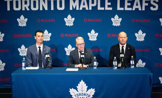 New Toronto Maple Leafs General Manager John Chayka, left to right, MLSE President and CEO Keith Pelley, and new Toronto Maple Leafs Senior Executive Advisor, Hockey Operations, Mats Sundin, hold a press conference in Toronto on Monday, May 4, 2026. (Arlyn McAdorey/The Canadian Press via AP)