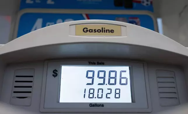 A total of $99.86 for gasoline is displayed at a fuel pump at a gas station on Wednesday, May 6, 2026, in Portland, Ore. (AP Photo/Jenny Kane)