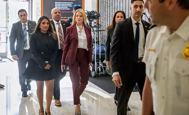 Former Attorney General Pam Bondi, center, arrives for her deposition at the Rayburn House Office Building on Capitol Hill, Friday, May 29, 2026, in Washington. (AP Photo/Rod Lamkey, Jr.)