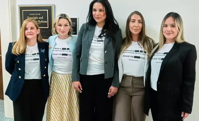Victims of Jeffrey Epstein's abuse, from left, Liz Stein, Dani Bensky, Sharlene Rochard, Marina Lacerda and Andrea Sterling, are seen before former Attorney General Pam Bondi arrives for her deposition at the Rayburn House Office Building on Capitol Hill, Friday, May 29, 2026, in Washington. (AP Photo/Manuel Ceneta)