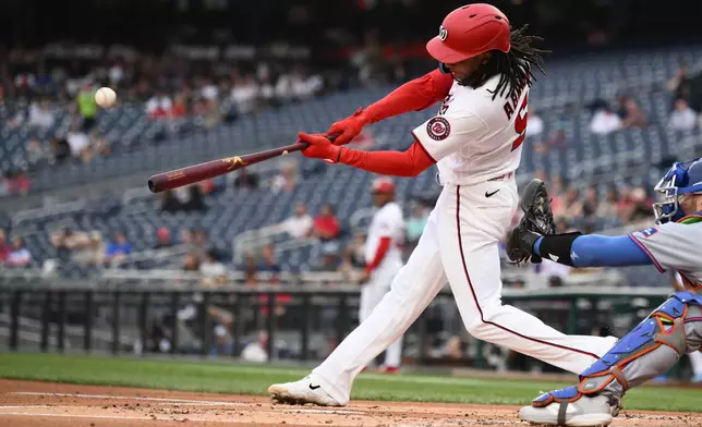 Washington Nationals' CJ Abrams hits a three-run home run during the first inning of a baseball game against the New York Mets, Wednesday, May 20, 2026, in Washington. (AP Photo/Nick Wass)