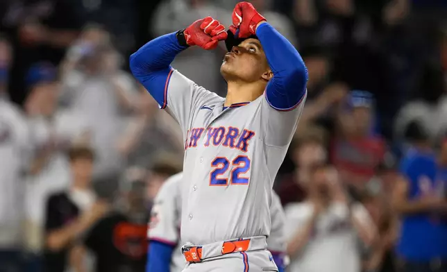 New York Mets' Juan Soto celebrates his two-run home run during the eighth inning of a baseball game against the Washington Nationals, Wednesday, May 20, 2026, in Washington. (AP Photo/Nick Wass)